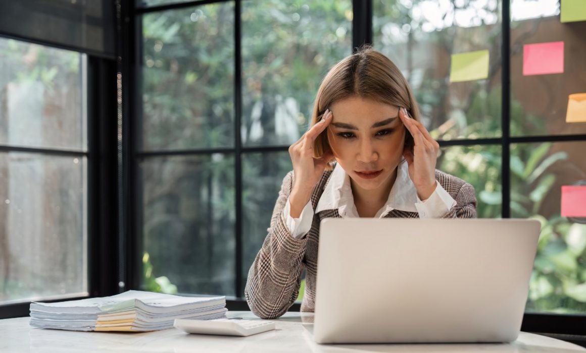 Frustrated woman on computer