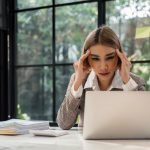 Frustrated woman on computer